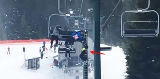 boy dangling from ski lift