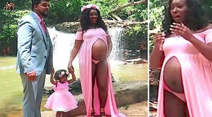 mom poses for maternity photo